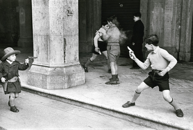 Henri Cartier-Bresson - Rome, Italy (Children Playing Cowboys with Guns) Henri Cartier-Bresson - Rome, Italy (Children Playing Cowboys with Guns)
