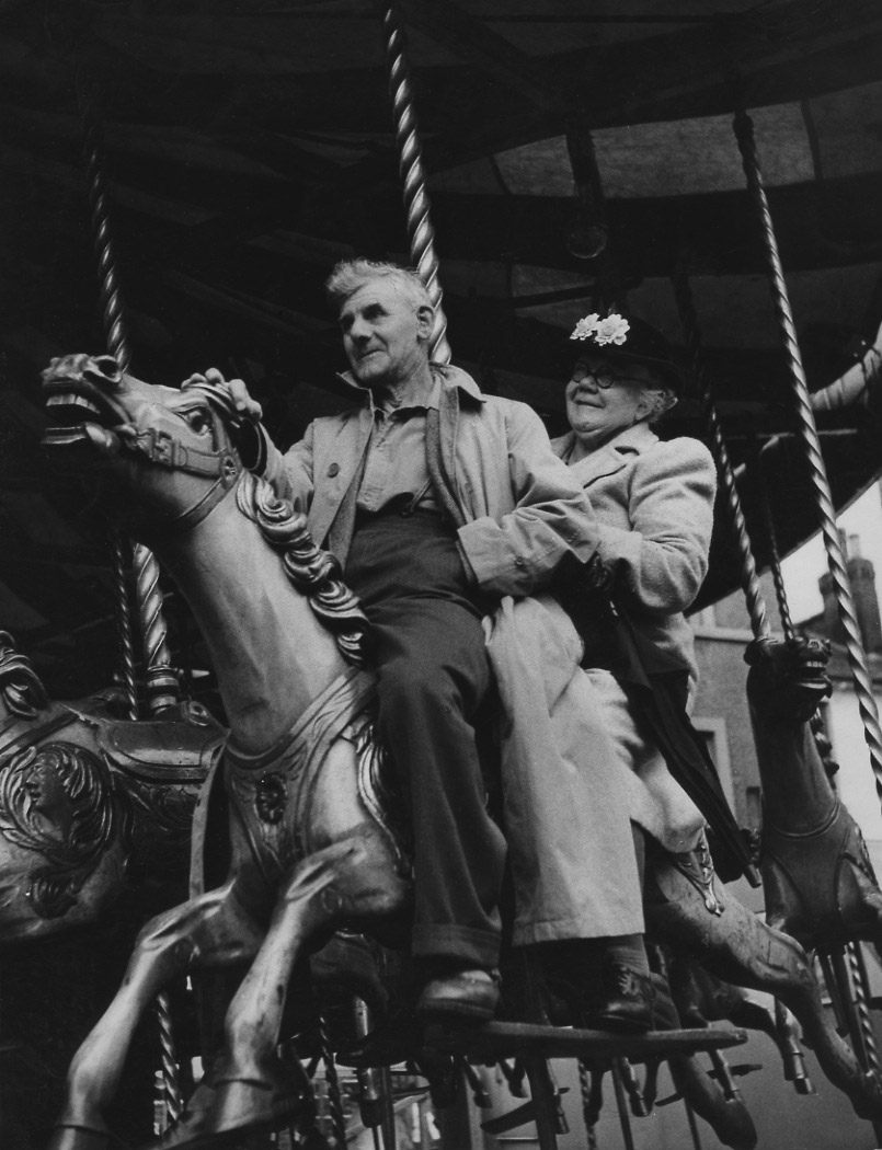 Izis (Israel Bidermanas) - A Couple on Carousel during August Bank Holiday Fair, London Izis (Israel Bidermanas) - A Couple on Carousel during August Bank Holiday Fair, London