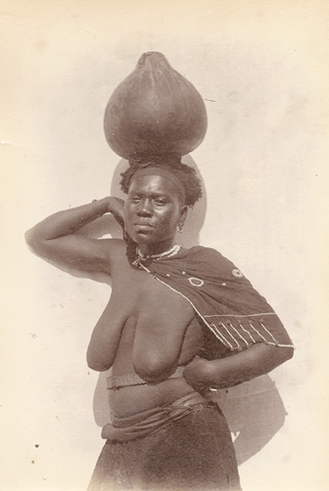 Anonymous - Partially Nude Bantu Woman Balancing a Water Gourd on Her Head Anonymous - Partially Nude Bantu Woman Balancing a Water Gourd on Her Head