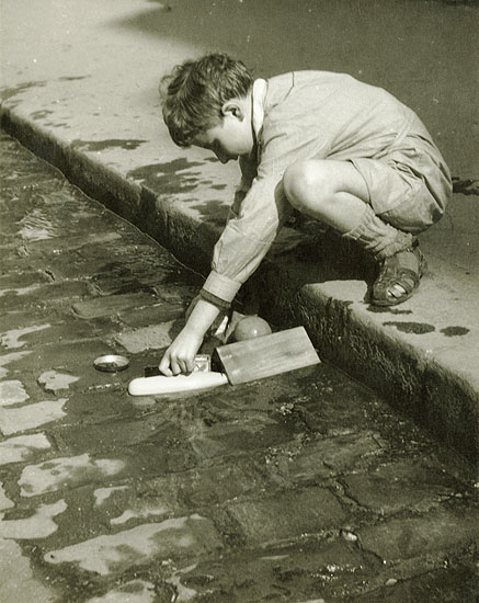 Pierre Auradon - Boy Playing by a Street Curb, Paris Pierre Auradon - Boy Playing by a Street Curb, Paris